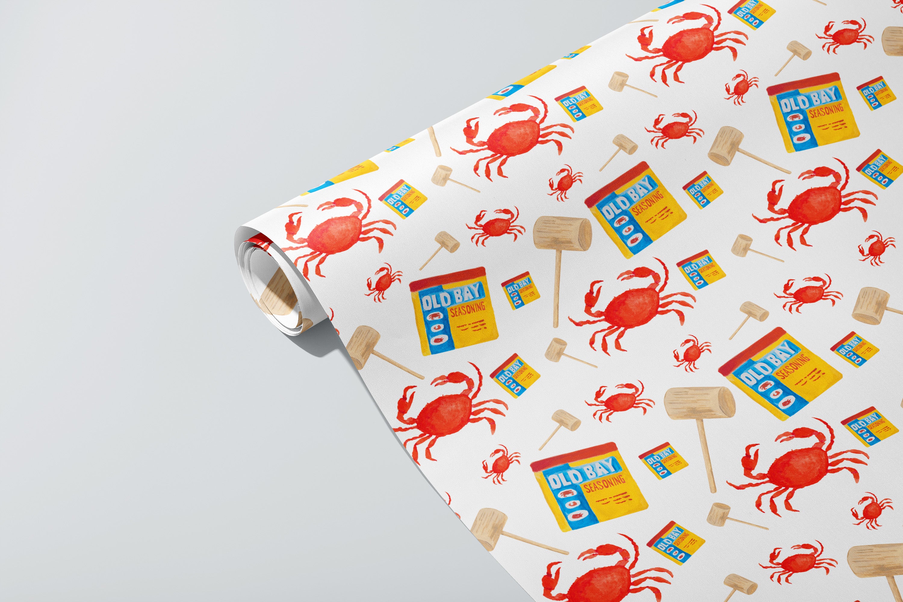 Roll of paper with red crabs, Old Bay and mallet illustrations. 